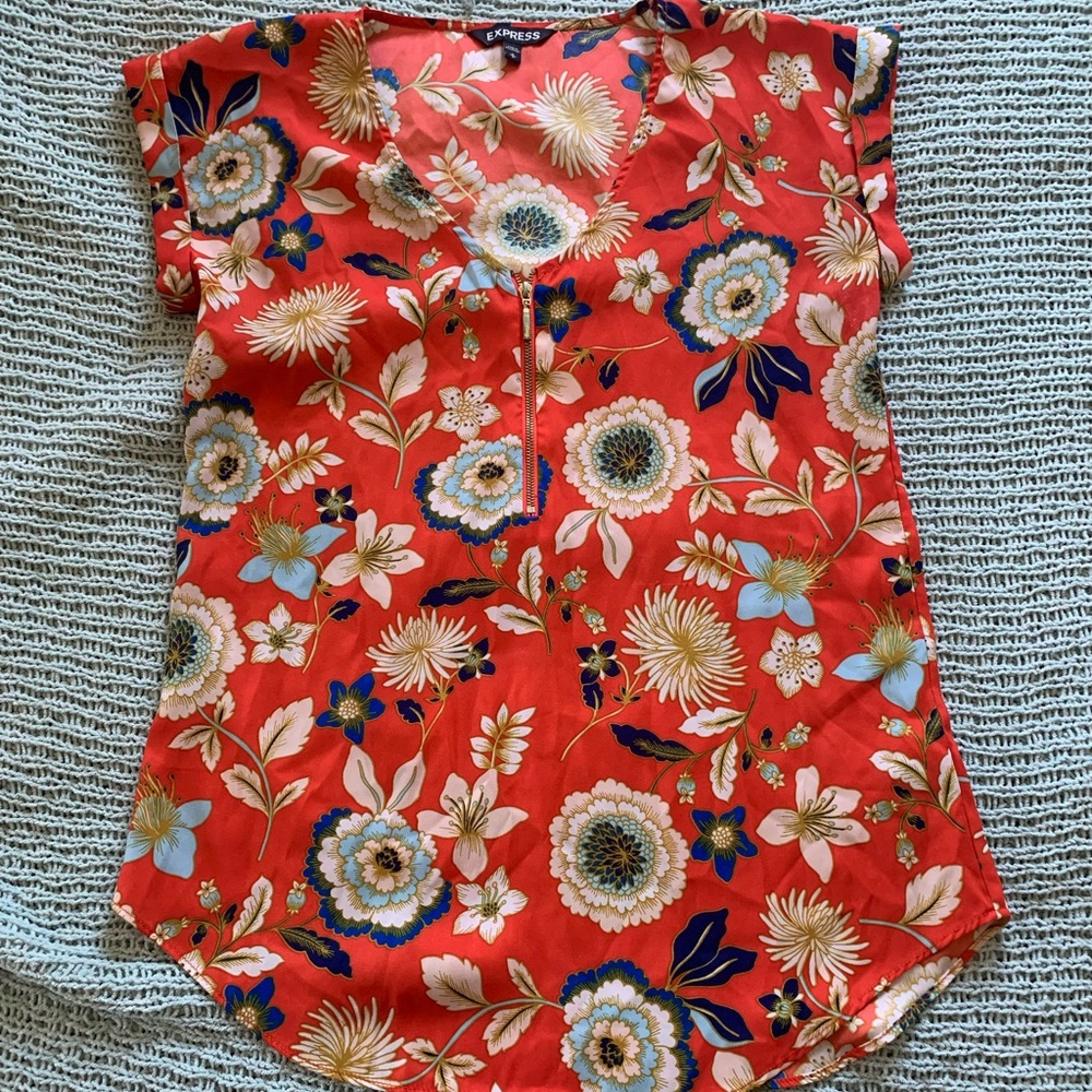 Orange, white, gold, and blue floral top.